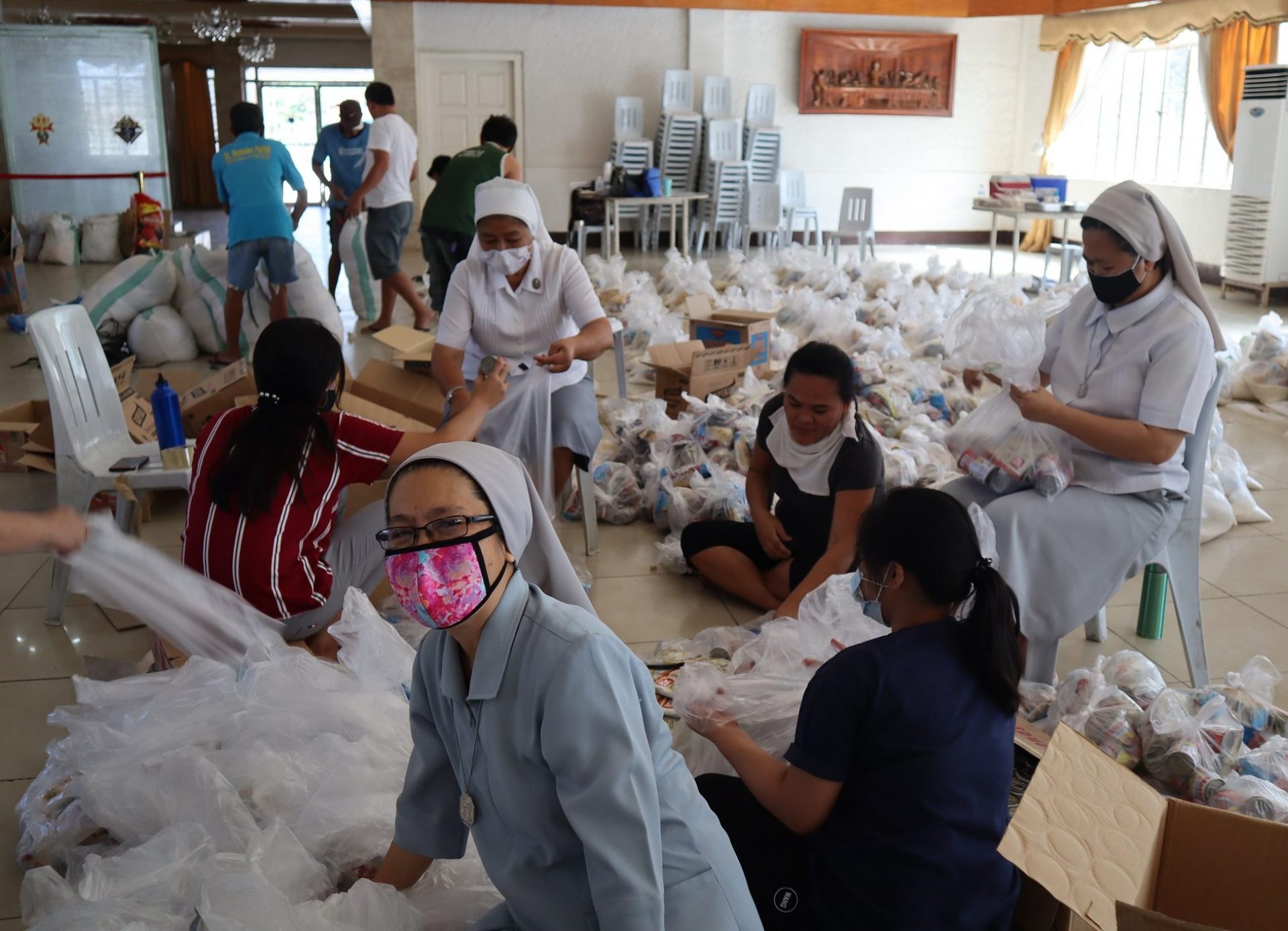 Philipppines 2020: Nuns from the Diocese of San Jose in Nueva Ecija repacks relief goods for the affected residents amidst the lockdown due to COVID-19.